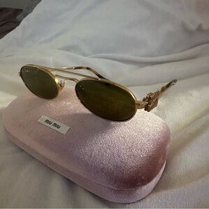 Miu Miu Oval Sunglasses